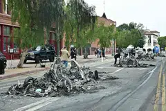 The remains of multiple burned Waymo vehicles are seen in the street following a night of protests in response to federal immigration operations in Los Angeles, on Jun 9.