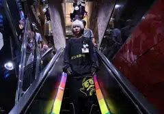 Hinako Mori, who has dyed her hair, heading to her work floor at a store of Japanese retailer Don Quijote in Tokyo.  
