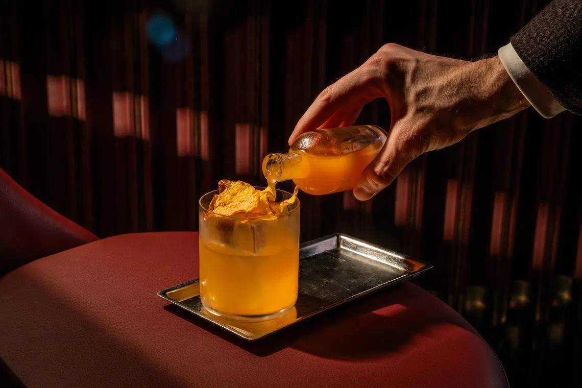 Autumnal Amber is a riff on the classic Penicillin, where rum replaces Scotch and spiced pumpkin replaces ginger, swirled with Laphroaig.