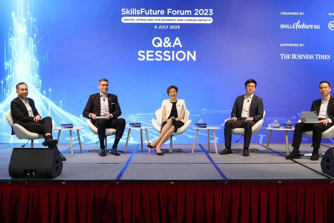 Panellists at the Skillsfuture Forum 2023. (from left): Tan Kok Yam, chief executive of SkillsFuture Singapore; Aslam Sardar, chief executive officer, Institute for Human Resource Professionals; Lee Hui Li, managing director, Microsoft Singapore; Lee Kian Chong, CEO, Deli in the Park; Christopher Lim, associate editor (product), The Business Times.