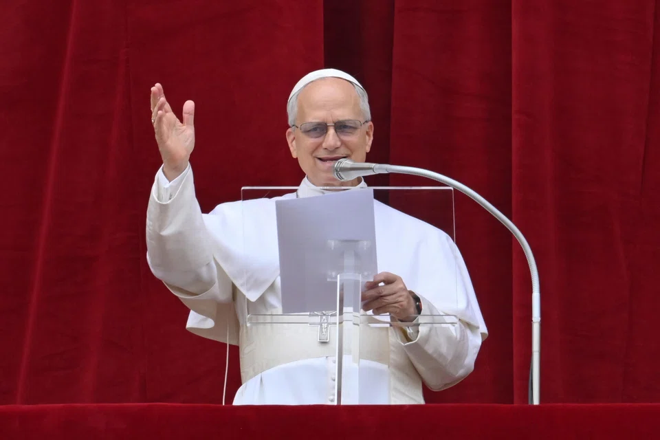 epa12090647 Pope Leo XIV leads the Regina Caeli prayer from the central loggia of Saint Peter's Basilica in Vatican City, 11 May 2025.  EPA-EFE/ALESSANDRO DI MEO
