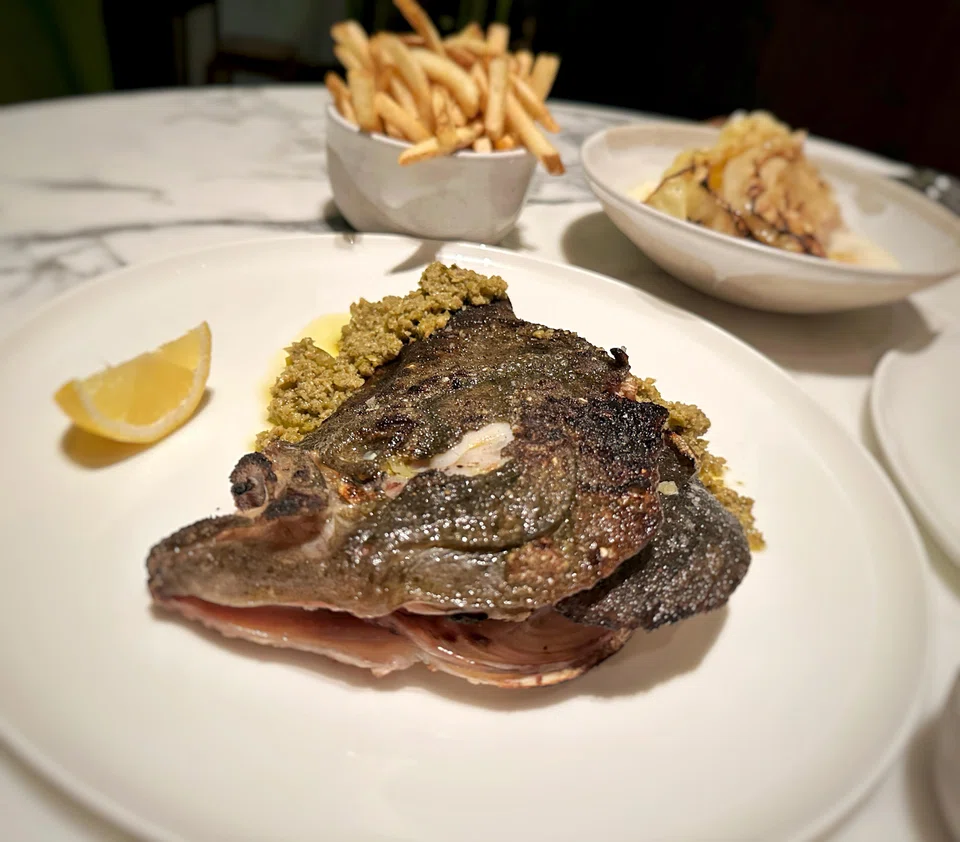 Roast turbot head is paired with chunky olive tapenade.