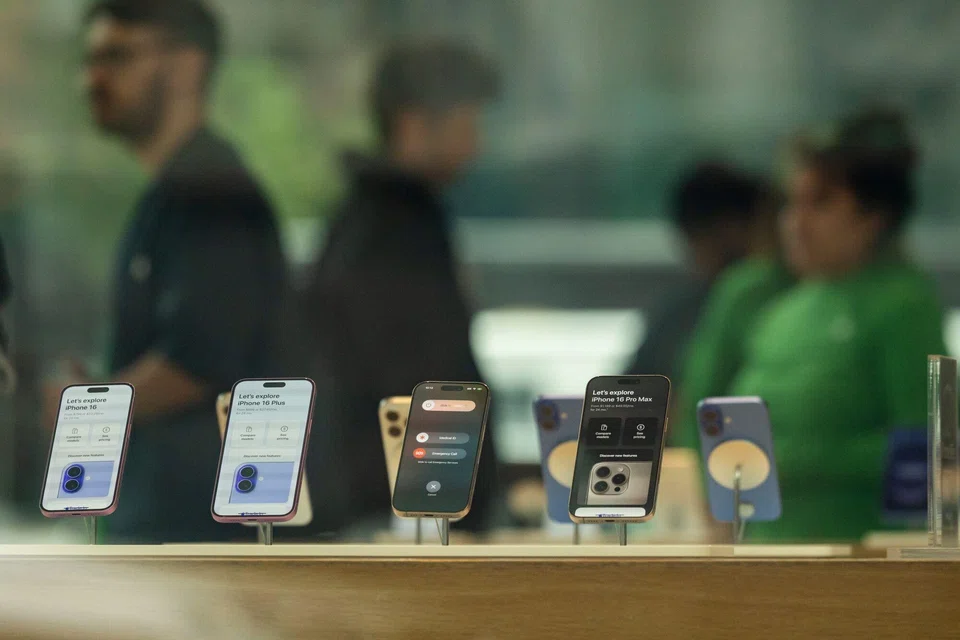 iPhone 16 and iPhone 16 Plus smartphones at an Apple store in New York. President Trump has vowed to a slap a 25 per cent duty on iPhones unless production is brought back to the US from China.