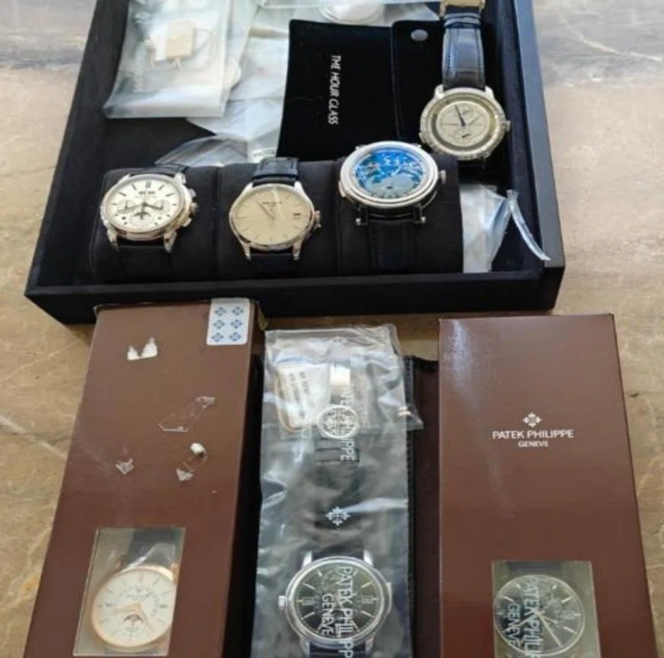 Watches seized by the police in their investigation into Chen Zhi's scam syndicate.