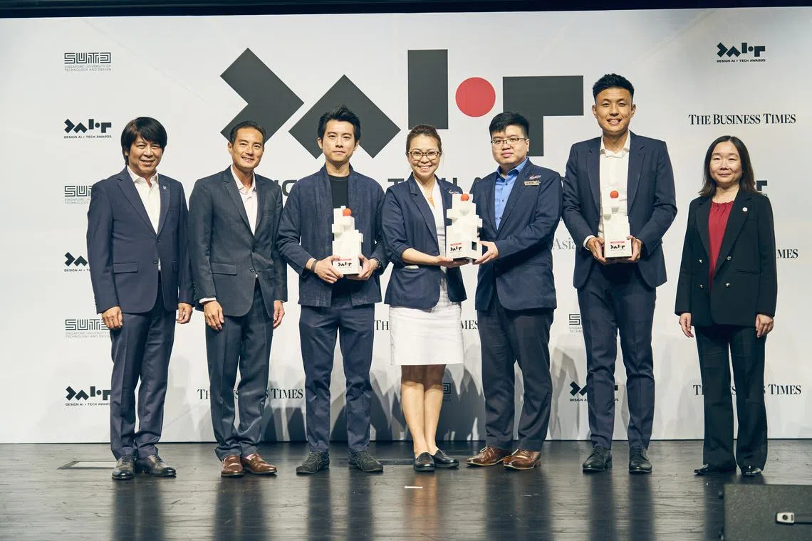 (From left) SUTD's Tai Lee Siang; Senior Minister of State for Digital Development and Information and National Development Tan Kiat How; LionsBot's Tan Wei Hua; Sengkang General Hospital's Moarie Grace Tan and Jeff Tang; MetaOptics Technologies'  Aloysius Chua; and BT editor Chen Huifen.