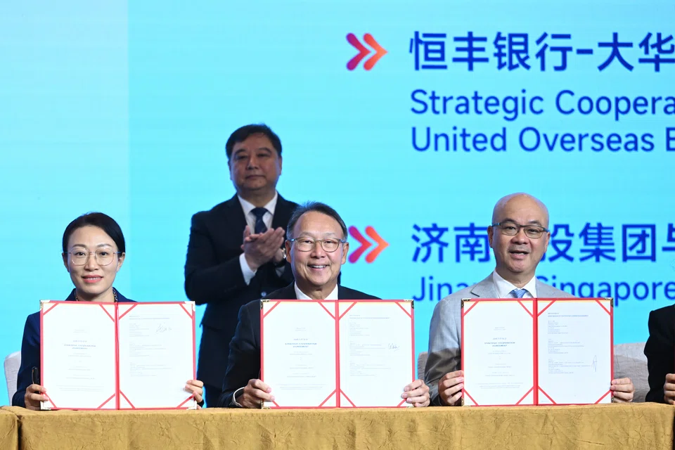 (From left) Hengfeng Bank vice president Fang Yi, UOB head of group commercial banking Eric Lian and UOB China president and chief executive officer Peter Foo signed an agreement to help more Chinese companies expand into South-east Asia.
