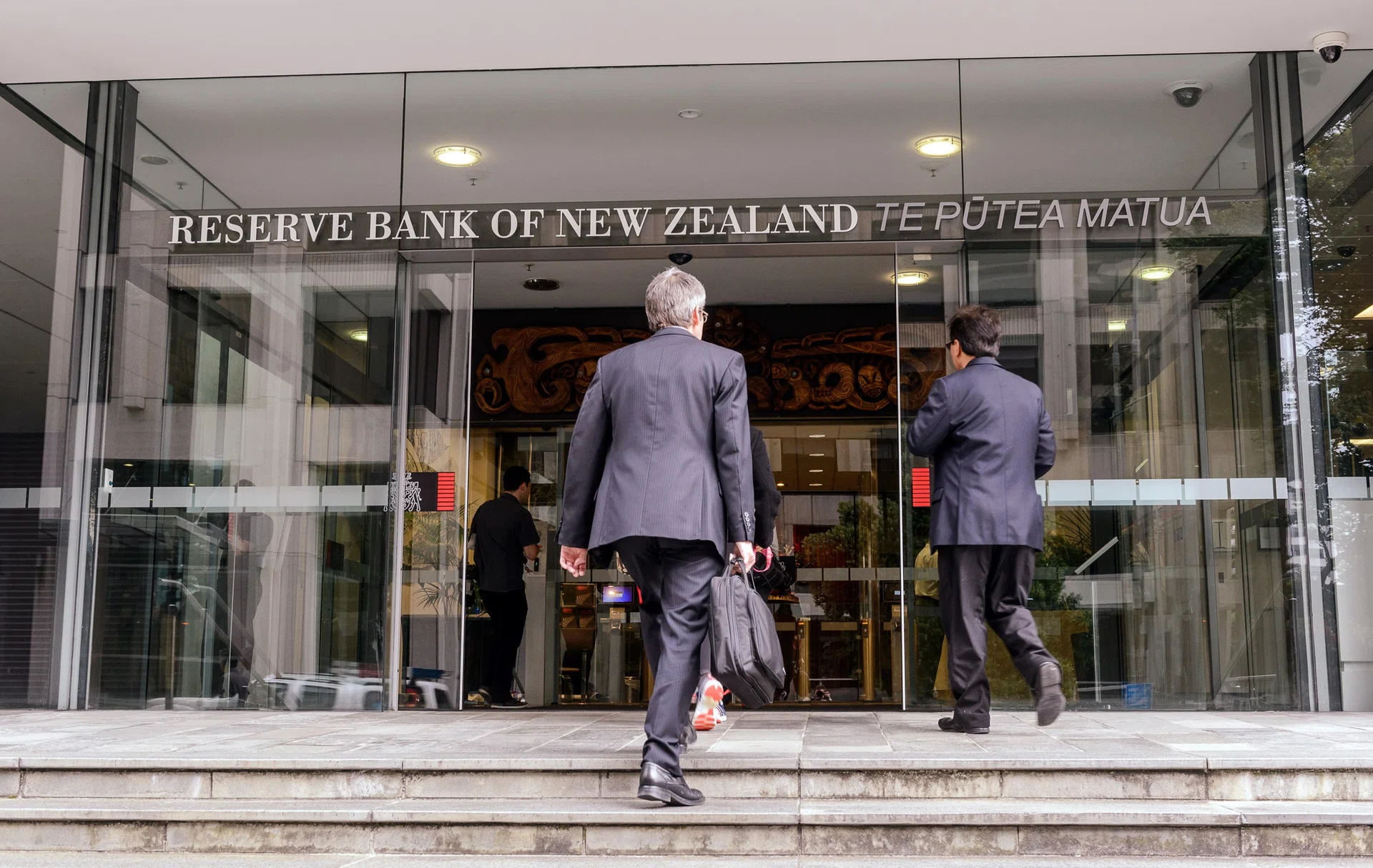 New Zealand central bank raises rates by 25 bps, flags gradual tightening path