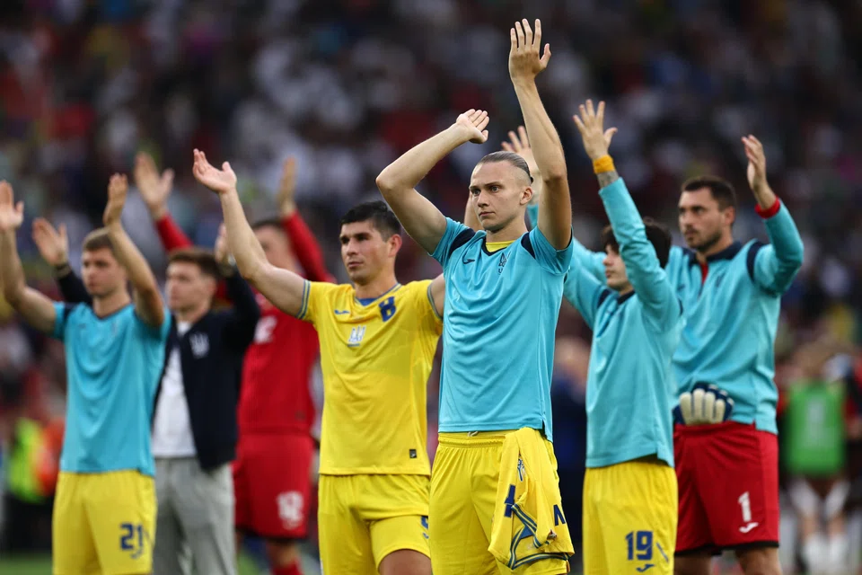 Ukrainian players thank their supporters after their 0-0 draw against Belgium in Stuttgart, Germany, June 26, 2024.  Ukraine finished bottom of their group and failed to progress to the second round.