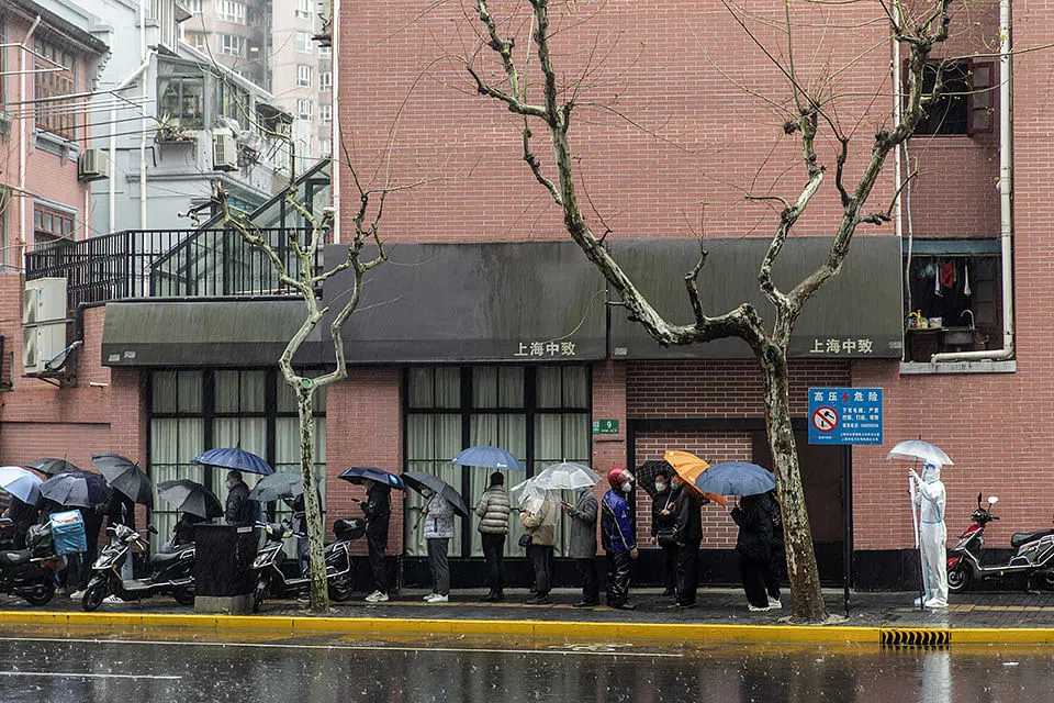 Shanghai's cases hit a record as Covid curbs lead to one death