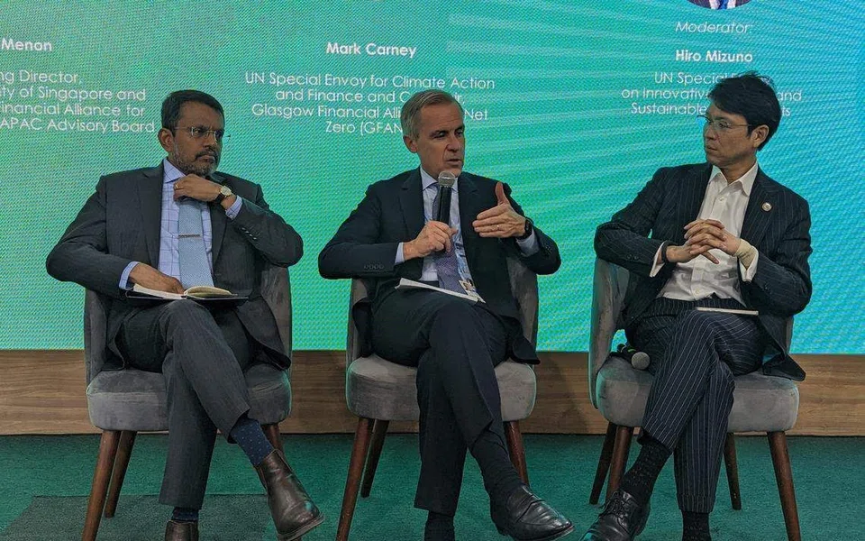 From left: Ravi Menon, managing director of the Monetary Authority of Singapore, Mark Carney, co-chair of the Glasgow Financial Alliance for Net Zero, and Hiro Mizuno, UN Special Envoy on Innovative Finance and Sustainable Investments. 