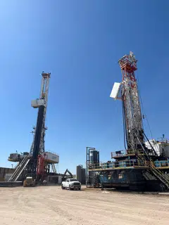 A weaker dollar makes oil cheaper for holders of other currencies, while rate cuts could spur economic growth and boost oil demand.