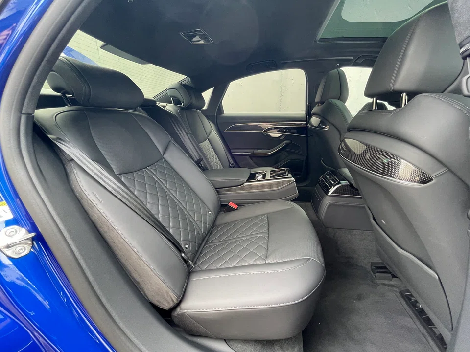 As an Audi flagship, the focus is on cosseting its passengers, with massage chairs and an opulent if business-like cabin.