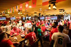 Soccer fans pack the Red Lion, a pub discreetly tucked inside a hotel, in Doha, Qatar, on Monday, Nov. 21, 2022. The Red Lion Pub is an oasis for World Cup fans who are hoping to get some beer while in Qatar.  
