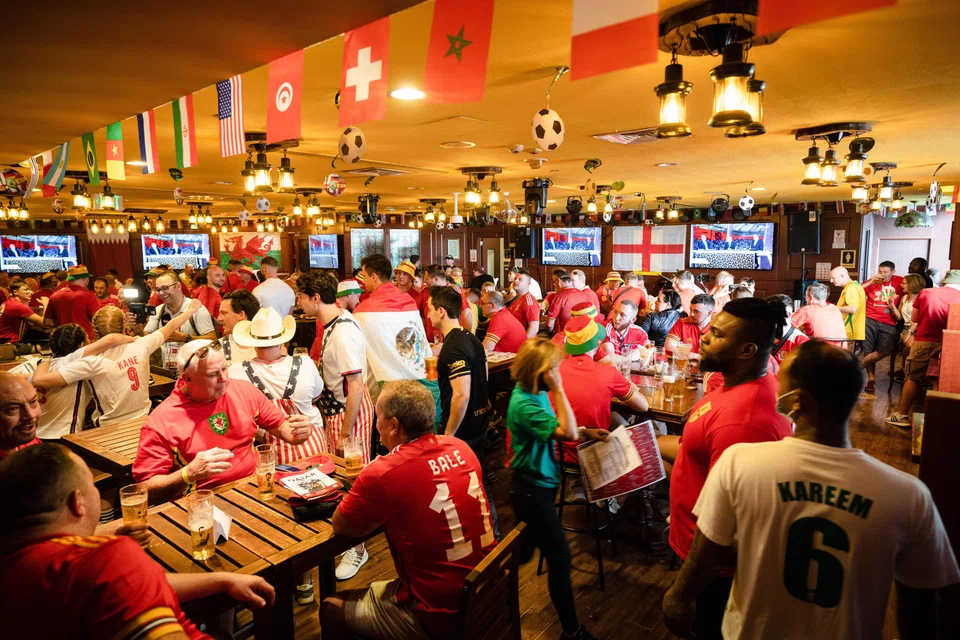 Soccer fans pack the Red Lion, a pub discreetly tucked inside a hotel, in Doha, Qatar, on Monday, Nov. 21, 2022. The Red Lion Pub is an oasis for World Cup fans who are hoping to get some beer while in Qatar.  