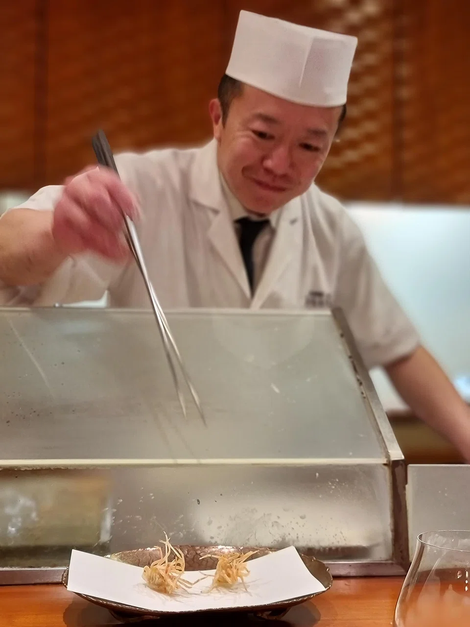 The friendly chef of Hiraishi serves up tempura with a light crunchy batter.