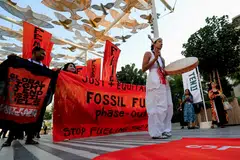Activists participate in a demonstration against fossil fuels, during the United Nations Climate Change Conference COP28 in Dubai, United Arab Emirates, Dec 5, 2023. 