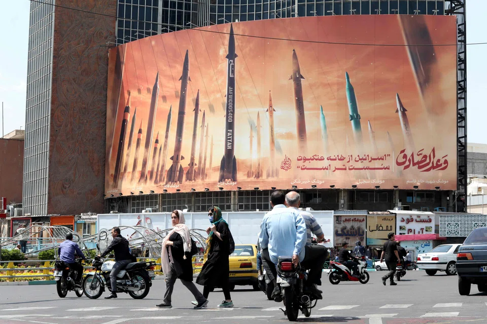 A billboard in Teheran depicts Iranian missiles. Israel's strike on Iran last week was downplayed by both sides, but that does not rule out future direct clashes.