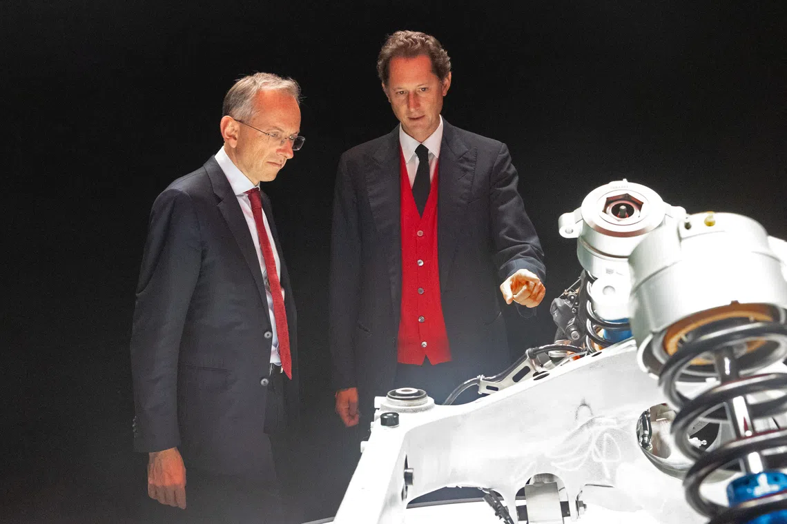 Ferrari CEO Benedetto Vigna (left) and John Elkann, Executive Chairman of Ferrari examine components of the upcoming Ferrari Elettrica at Capital Markets Day 