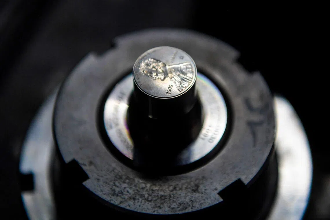 The dies used to press the last pennies sit on display at the US Mint on November 12, 2025 in Philadelphia, Pennsylvania. 