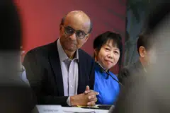 Presidential hopeful Tharman Shanmugaratnam at a media conference on July 26, 2023 held at York Hotel. With him is his wife, Jane Yumiko Ittogi (in blue).