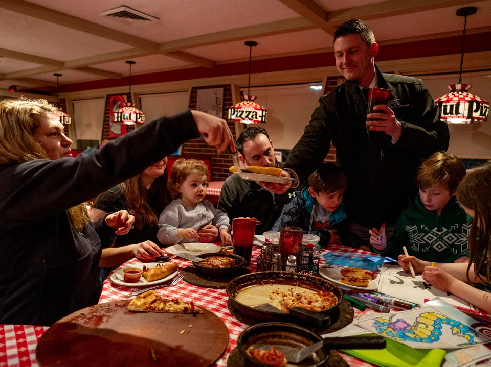 Erik Vanston, Jessica Pizano and their family dine at a Pizza Hut Classics in Tunkhannock, Pennsylvania, Feb 25, 2026.