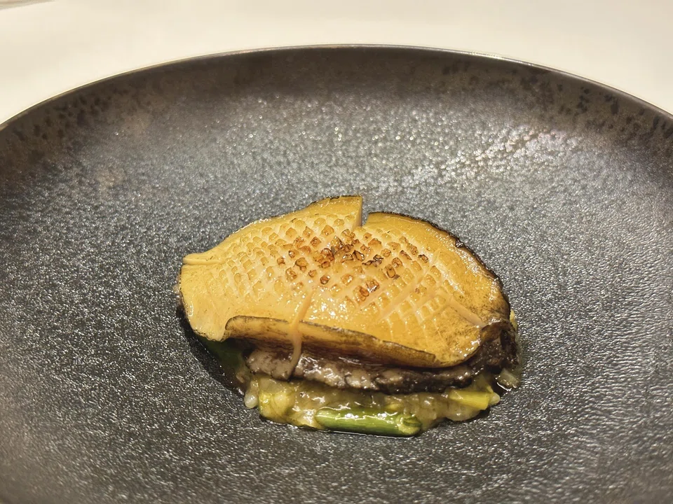 Creamy porridge topped with grilled Jeju abalone.