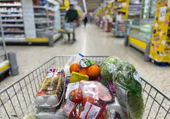 A customer shops for food items inside a Tesco supermarket store in east London. The UK economy is rapidly slipping into an inflationary recession, and analysts and economists fear that the situation is likely to worsen during the upcoming winter.