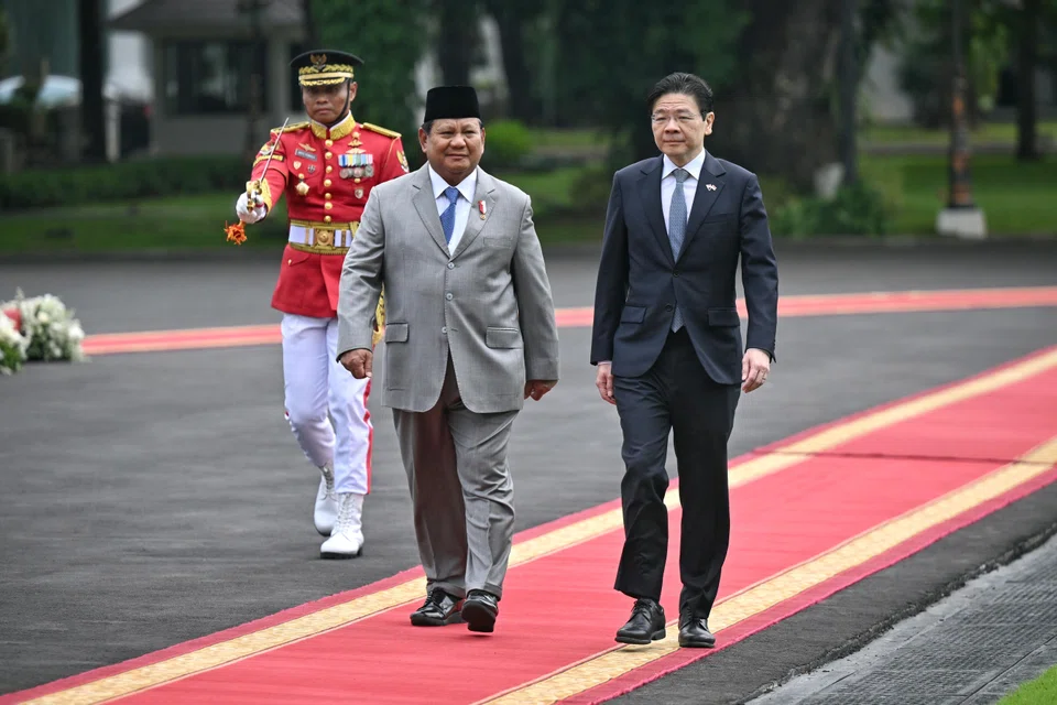 Indonesian President Prabowo Subianto welcoming Singapore Prime Minister Lawrence Wong at the state palace in Jakarta, Indonesia, on Wednesday.