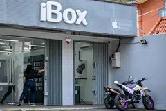 An employee of an authorised dealer selling Apple products opens a shop in Jakarta, Indonesia, Oct 29, 2024. Apple’s previous investment plan of close to US$10 million would have involved the company investing in a factory making accessories and components in Bandung.