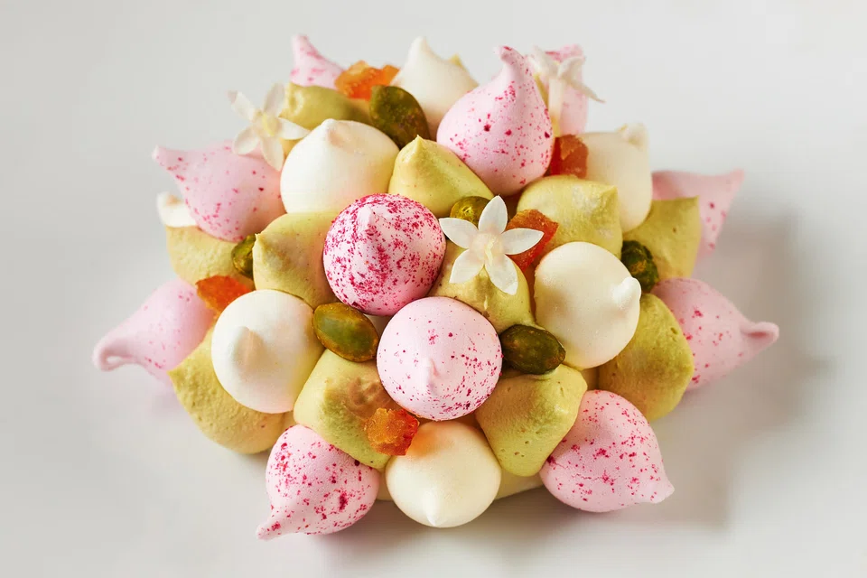 Citron Pistache Vacherin is a colourful dessert of meringue, ricotta gelato, pistachio cream and lemon jelly.