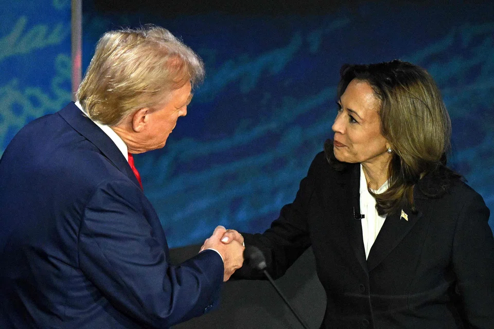US Vice-President and Democratic presidential candidate Kamala Harris shakes hands with former US President and Republican presidential candidate Donald Trump during a presidential debate at the National Constitution Centre in Philadelphia, Pennsylvania on Sep 10.