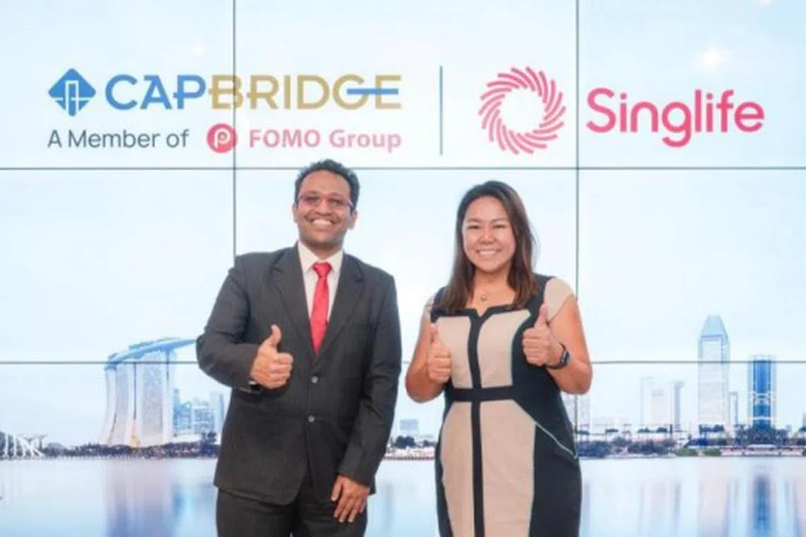 Varun Mittal, head of innovation and Ecosystem at Singlife (left), and Dr Janet Liu, chief executive officer at CapBridge. The collaboration expands CapBridge's range of products, and also deepens Singlife's engagement with SMEs.