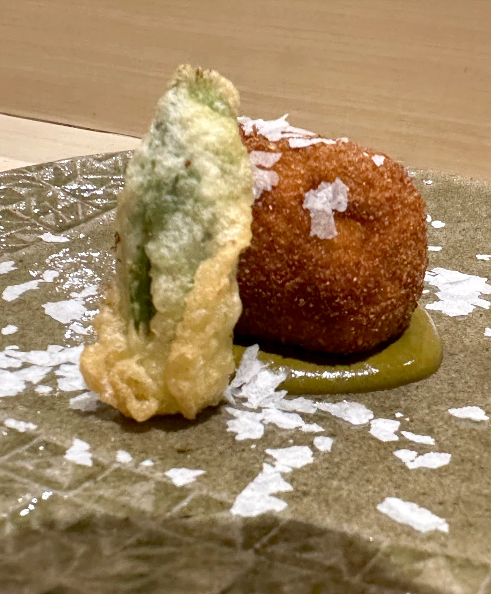 Abalone croquette is filled with chunks of shellfish in a bechamel filling.