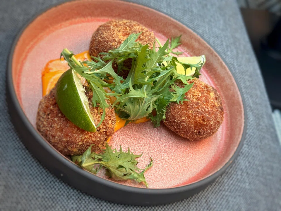 Crab cakes are packed with shredded crab meat and deep-fried for a crisp crumbed exterior.