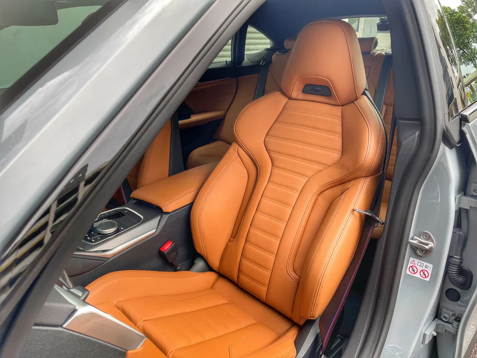 It might not look particularly futuristic, but the BMW i4 M50 can be unlocked with a smartphone, boots up with a whirr, and can run the air-con remotely.