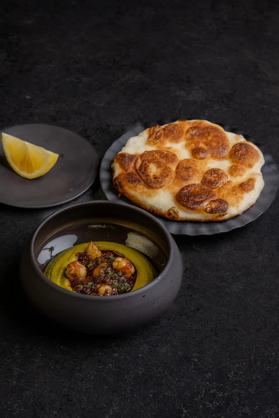 Very good flatbread is served with lentil hummus, XO sauce and prawns.