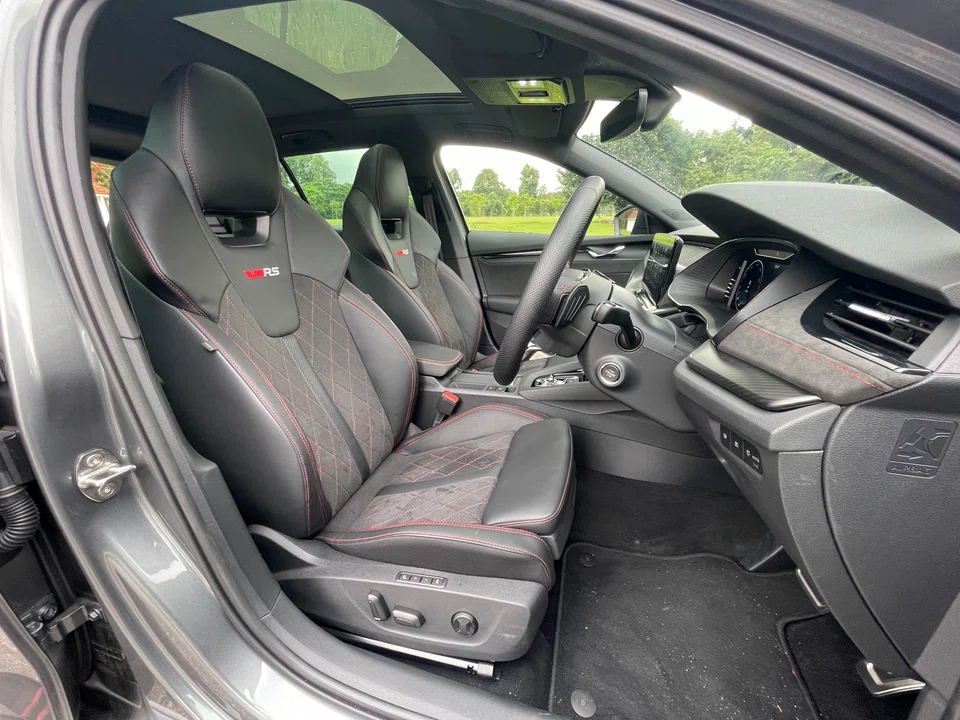 Skoda's Octavia Combi RS sports black body trim, racy red brake calipers and lovely, supportive bucket seats in front, as well as suede-like upholstery and red stitching in the cabin.