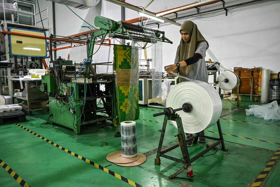 A factory worker in Selangor. The manufacturing output remained the primary driver of Malaysia's industrial production growth in September.