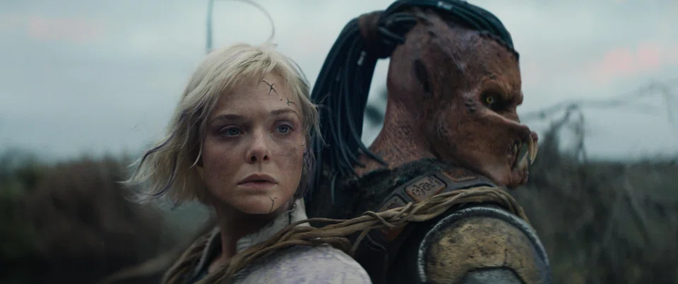 'Predator: Badlands' stars (from left) Elle Fanning as Thia and Dimitrius Schuster-Koloamatangi as Dek.