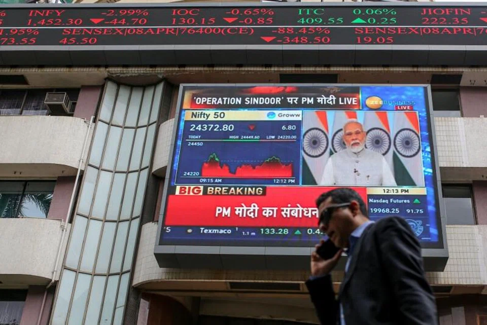 A news broadcast featuring Indian Prime Minister Narendra Modi displayed outside the Bombay Stock Exchange building in Mumbai.