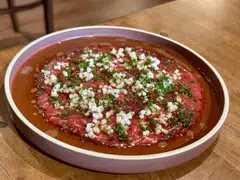 Batang Pinang features beef carpaccio dressed in a sharp vinaigrette.