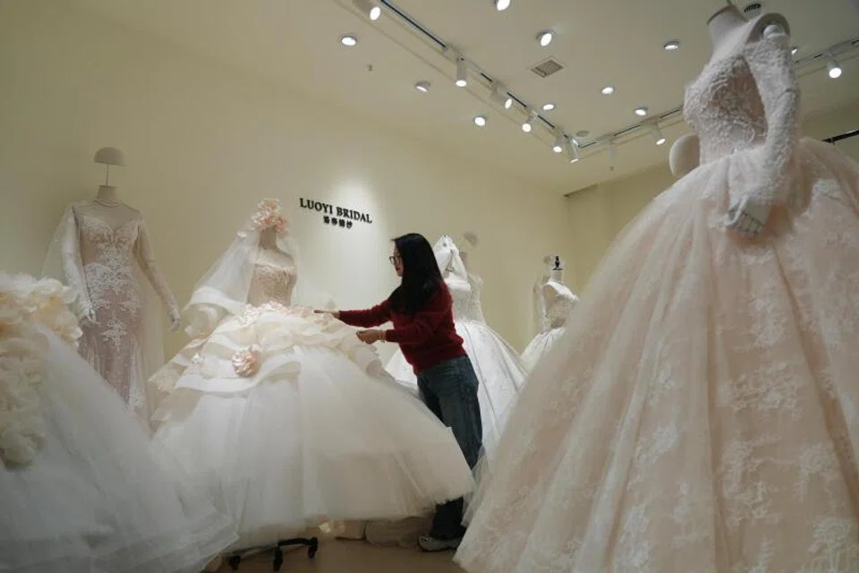 The sprawling Huqiu Bridal City is home to more than 800 stores filled with frothy white taffeta, silk and lace dresses.