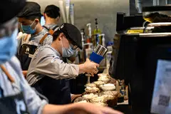 Luckin Coffee employees preparing baijiu liquor-flavoured latte, the latest product in collaboration with Chinese liquor brand Kweichow Moutai, in a Luckin Coffee shop in Beijing on Monday (Sep 4).