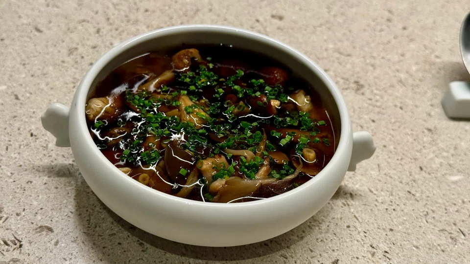 Vegettable broth-based chawanmushi with abalone and mushrooms.