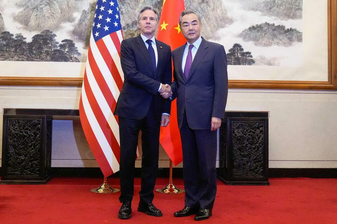 US Secretary of State Antony Blinken (left) shakes hands with China's Foreign Minister Wang Yi (right) during a meeting at the Diaoyutai State Guesthouse in Beijing, China, April 26, 2024. 