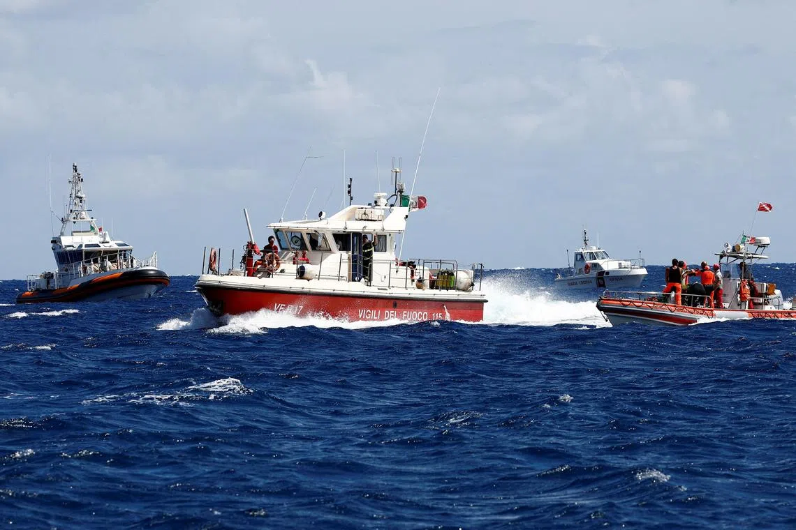 Rescue personnel in the area where the luxury yacht Bayesian sank, off the coast of Sicily.