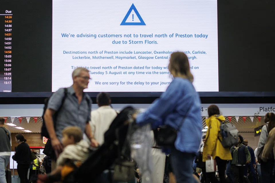 Passengers gather at Euston station as Storm Floris disrupts rail, road, and air travel across Scotland, Northern Ireland, Wales and northern England, London, Britain, Aug 4, 2025.