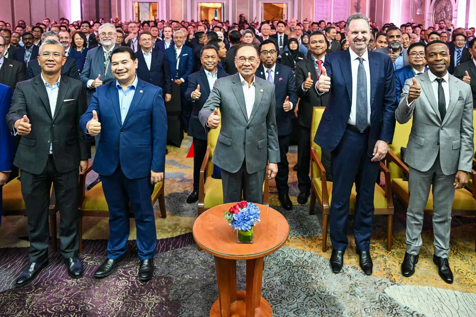 Malaysia's Prime Minister Anwar Ibrahim (centre) and British chip giant Arm Holdings CEO Rene Haas (second right) at a ceremony in Kuala Lumpur on Mar 5. 