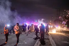 Law enforcement clashes with demonstrators during a protest following federal immigration operations, in the Compton neighborhood of Los Angeles, California on June 7.