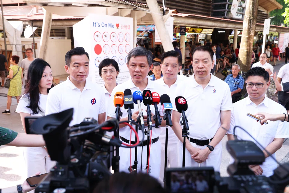 The PAP wins Tanjong Pagar GRC and two SMCs, Radin Mas and Queenstown. From left: party members Rachel Ong, Eric Chua, Joan Pereira, Chan Chun Sing, Alvin Tan, Melvin Yong​ and Foo Cexiang.